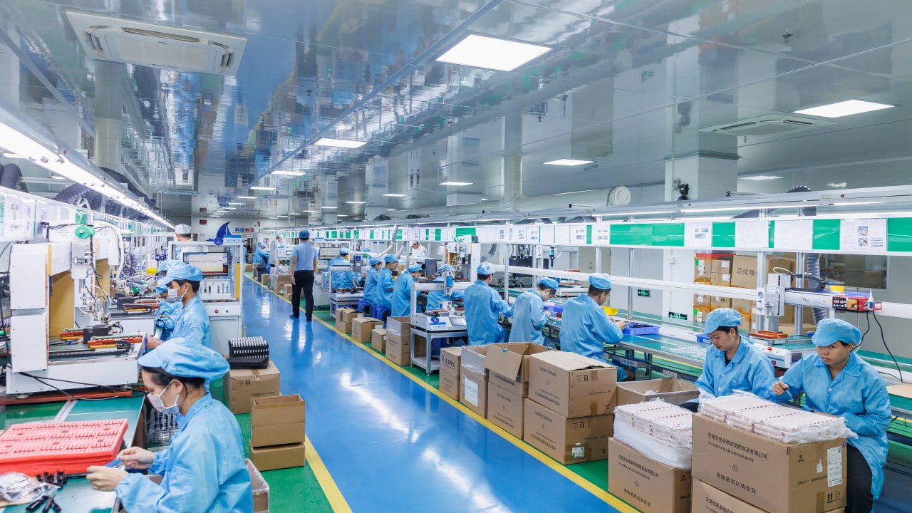 Finishing and assembly line with operators assembling and testing oral-care products