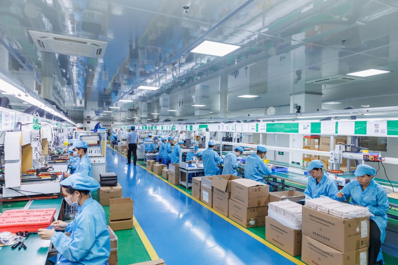 Xijunsong finishing and assembly workshop with operators on the production line