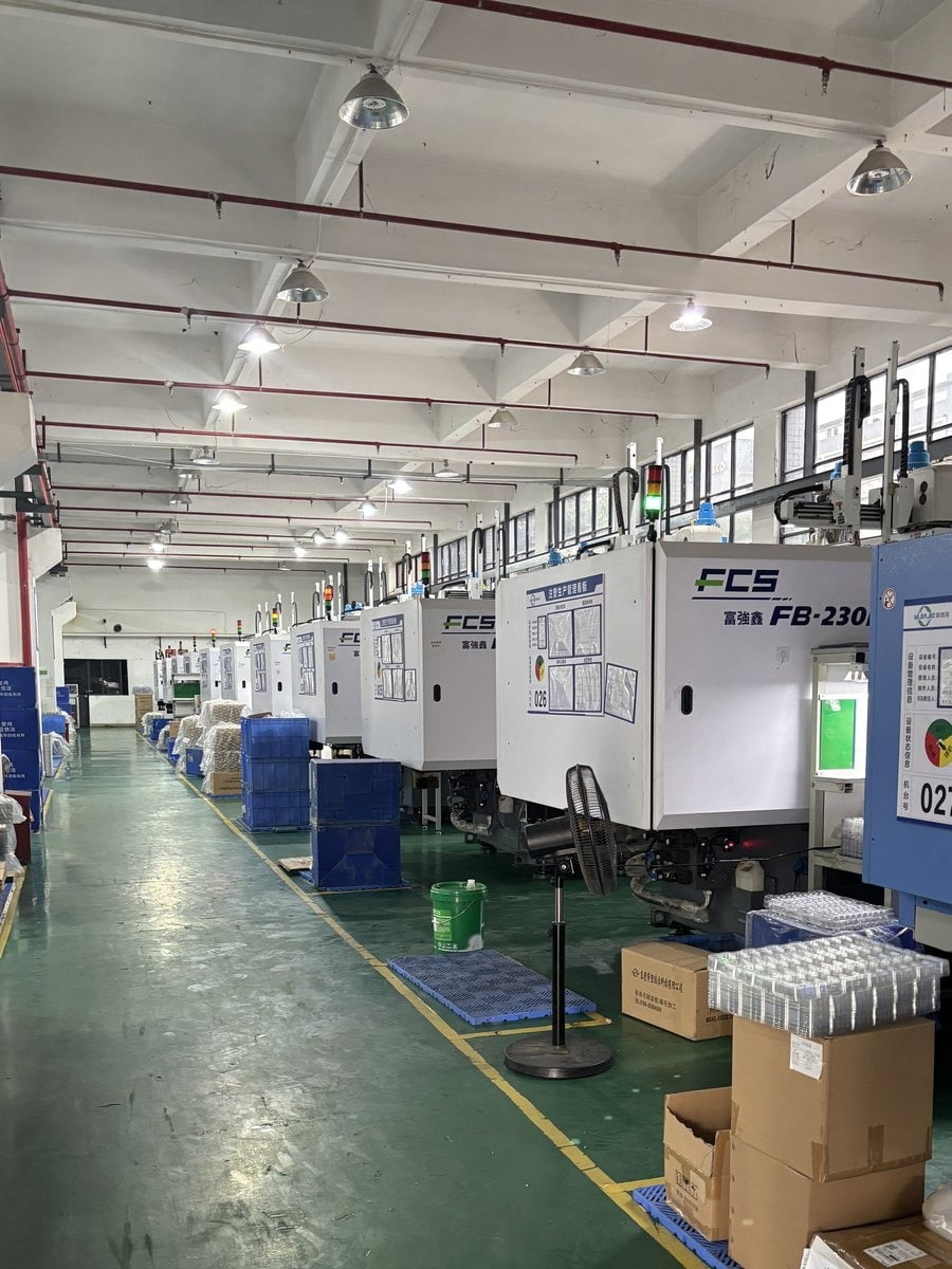 Row of injection molding machines in the workshop