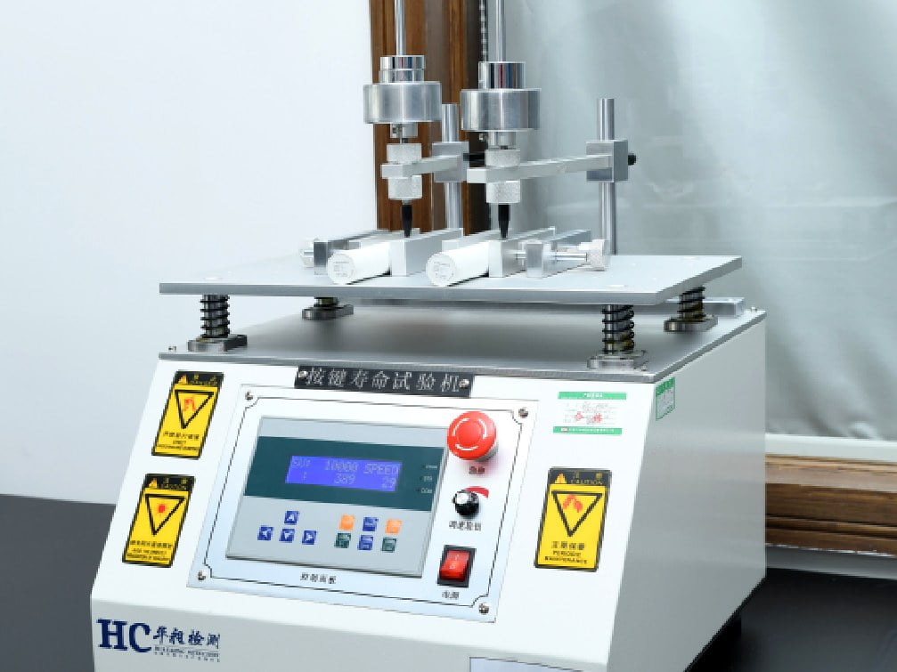 Button and switch life testing machine with dual pressing stations