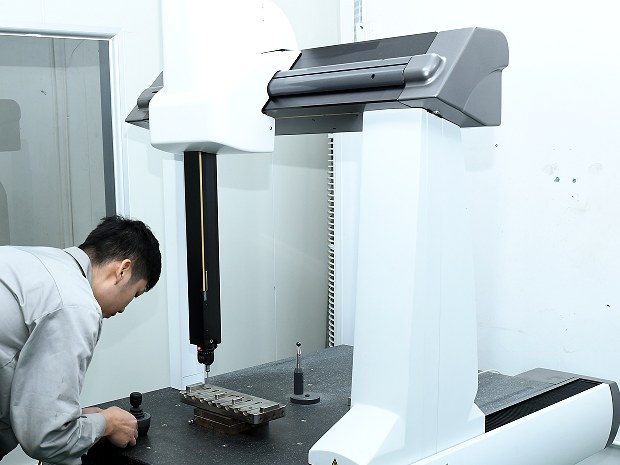 Coordinate measuring machine checking a precision component
